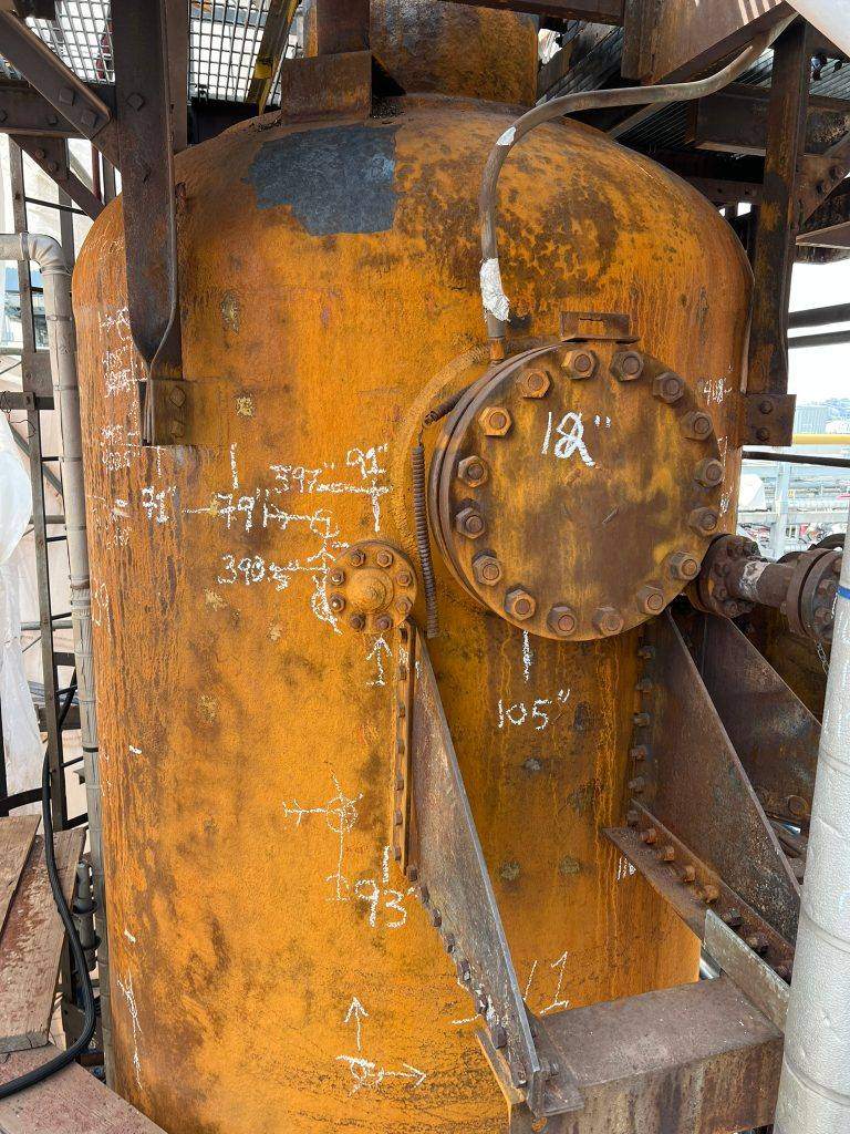Process vessel shell and 12 inch manway before cleaning, heavy orange rust