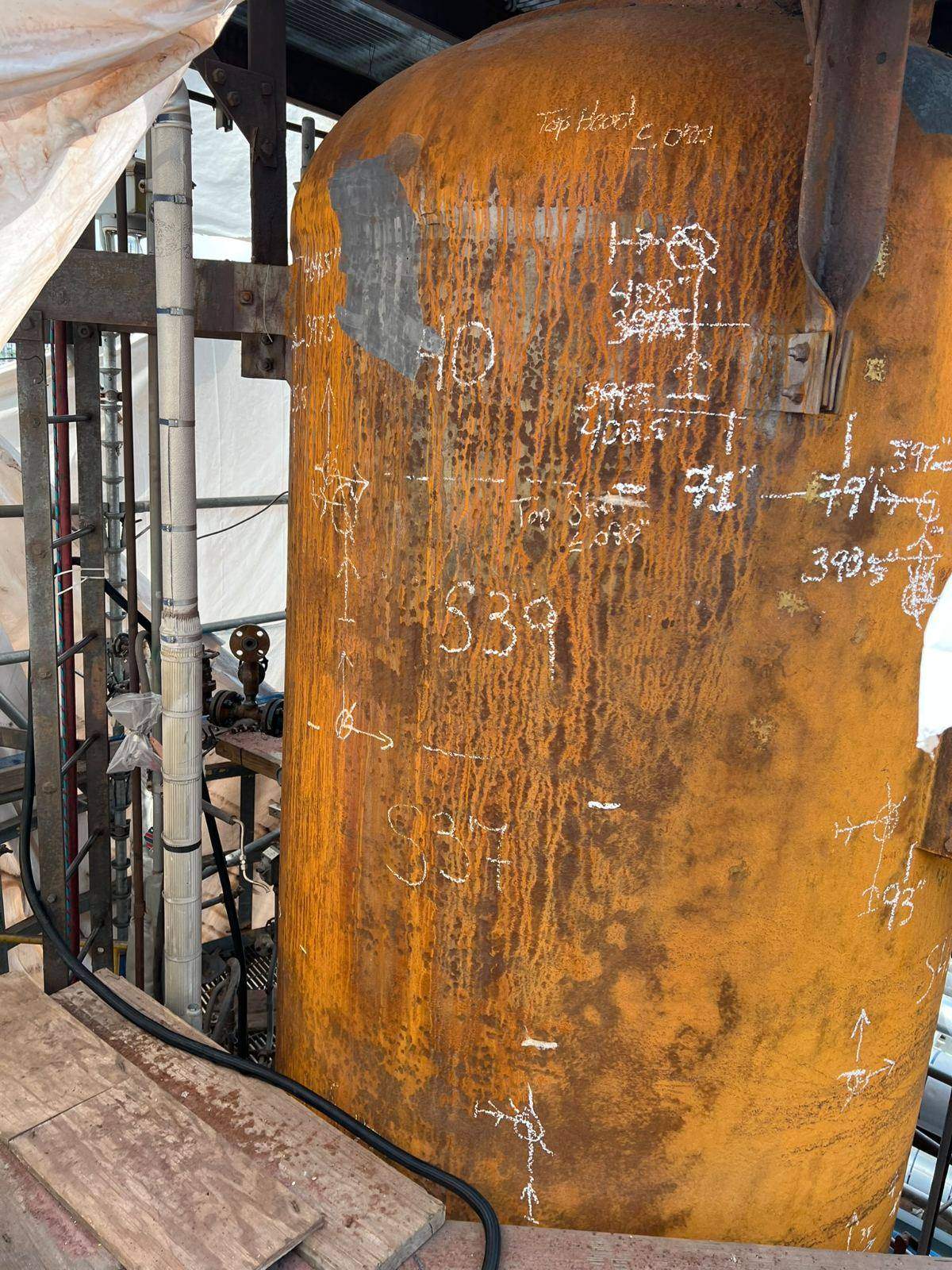 Vessel shell with chalk survey marks and heavy rust