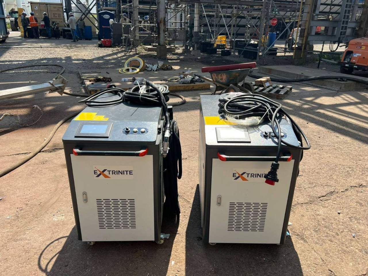 Two Extrinite laser cleaning units on a job site yard